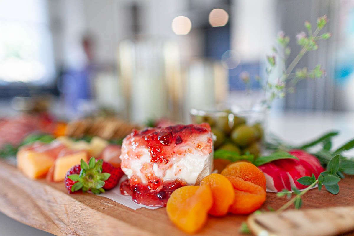 picture of goat cheese with homemade fig spread on a charcuterie board