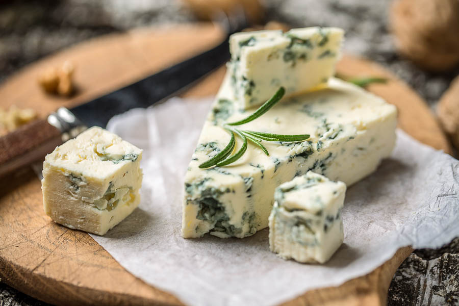 stilton cheese on white parchment paper