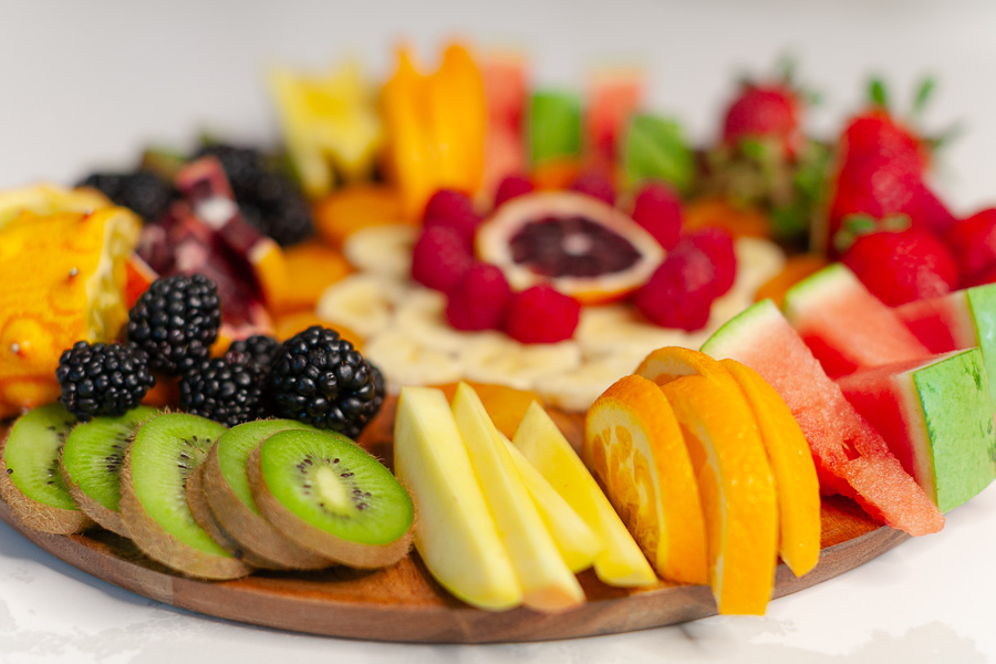 round charcuterie board with fresh fruit